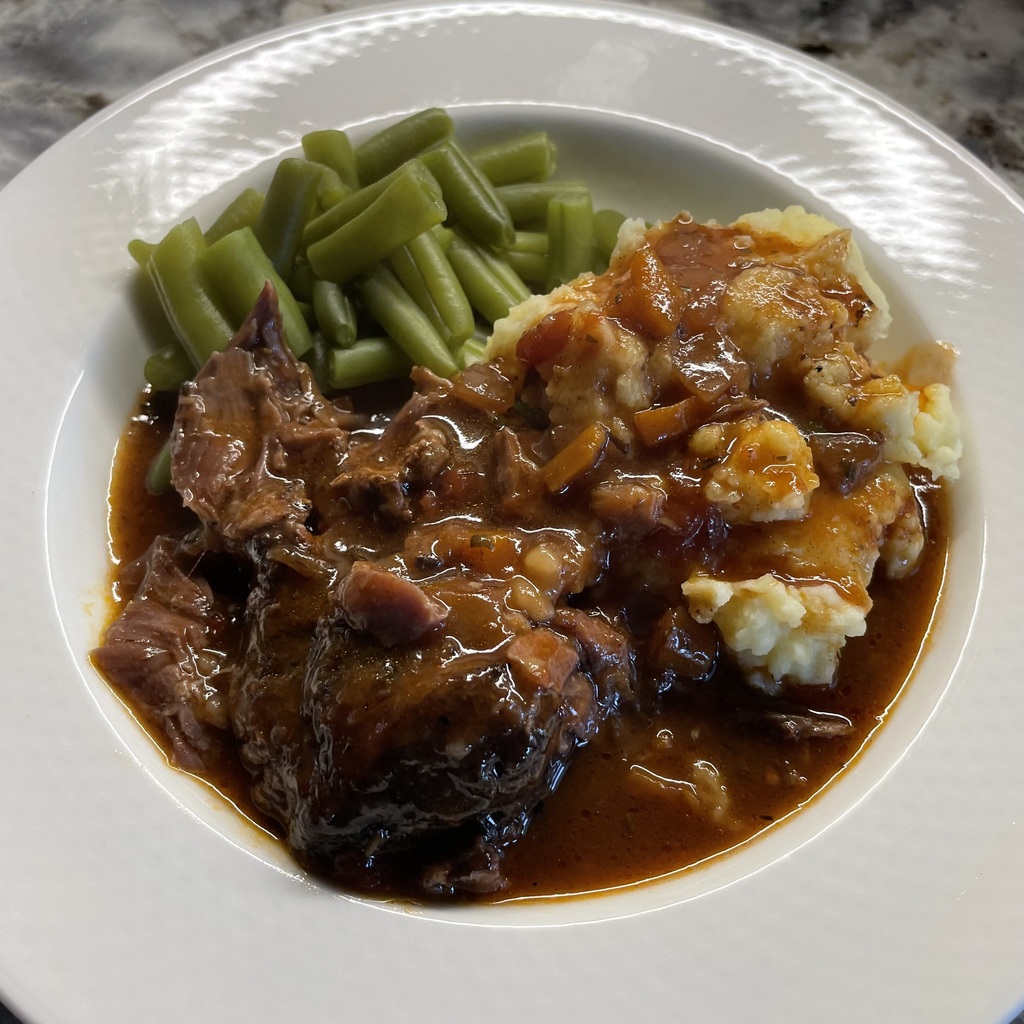 Osso Bucco Plated with Mashed Potatoes and Green Beans